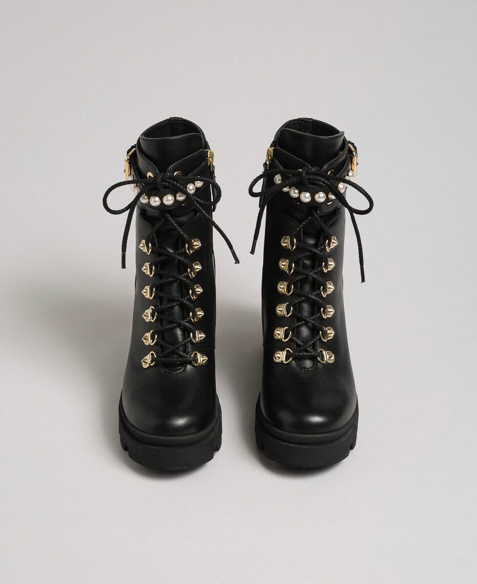 Leather combat boots with heel and pearls