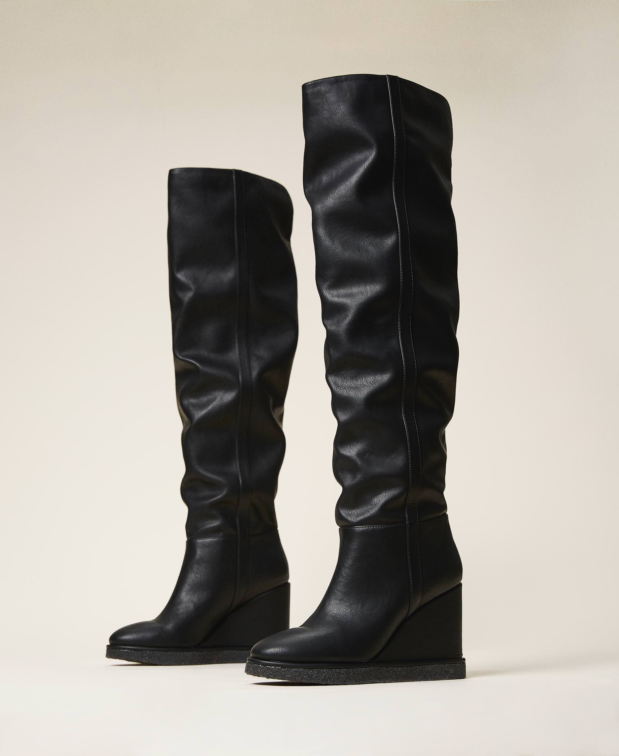 Thigh-high boots with wedge Woman 