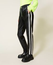 Pantalon de jogging avec bandes contrastées Bicolore Noir / Blanc Nacre Femme 212AT2401-04