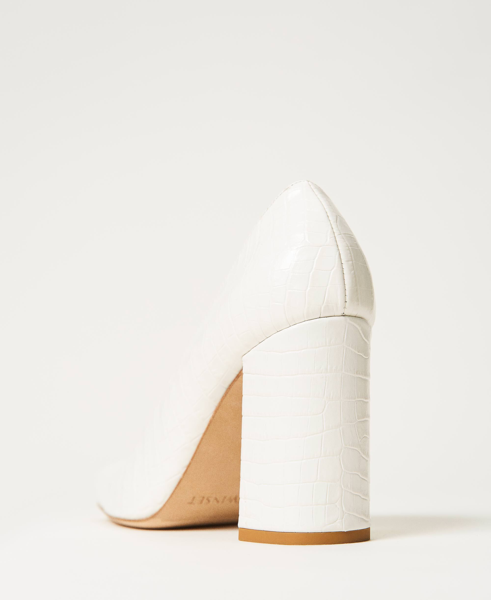 white leather court shoes