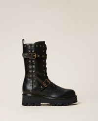 Leather combat boots with decorative eyelets