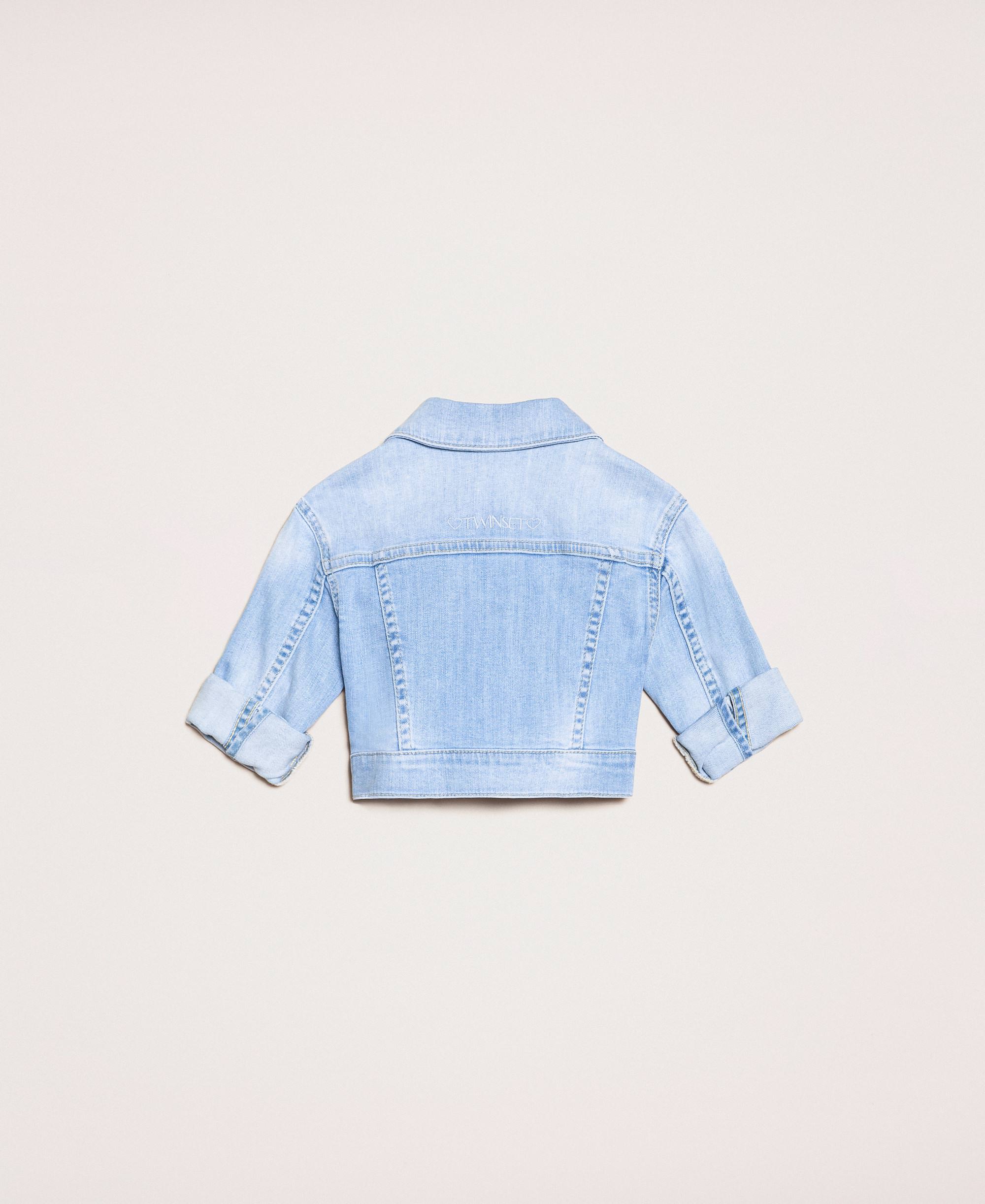 denim jacket with rips in back