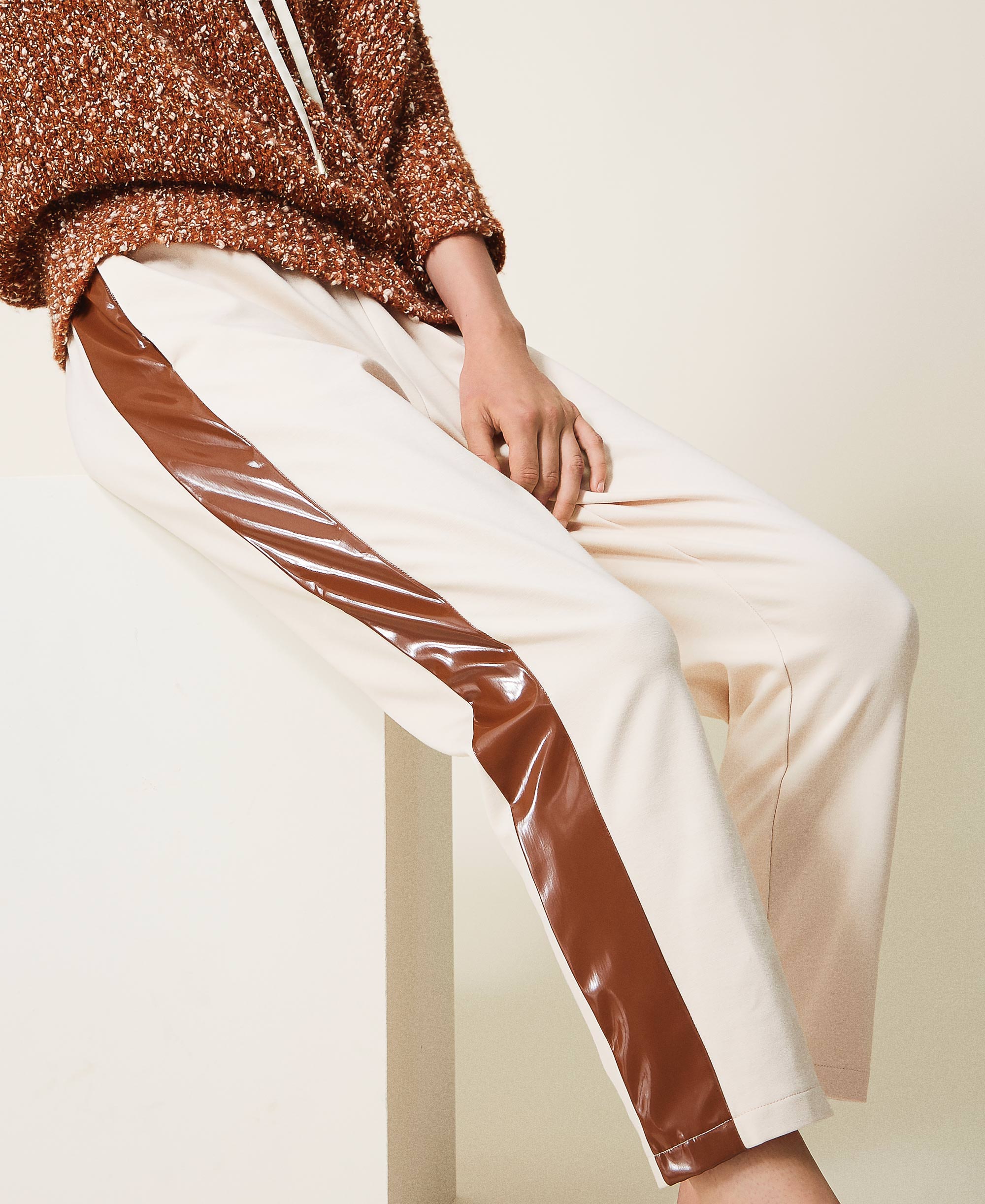 Trousers with patent leather inlays 