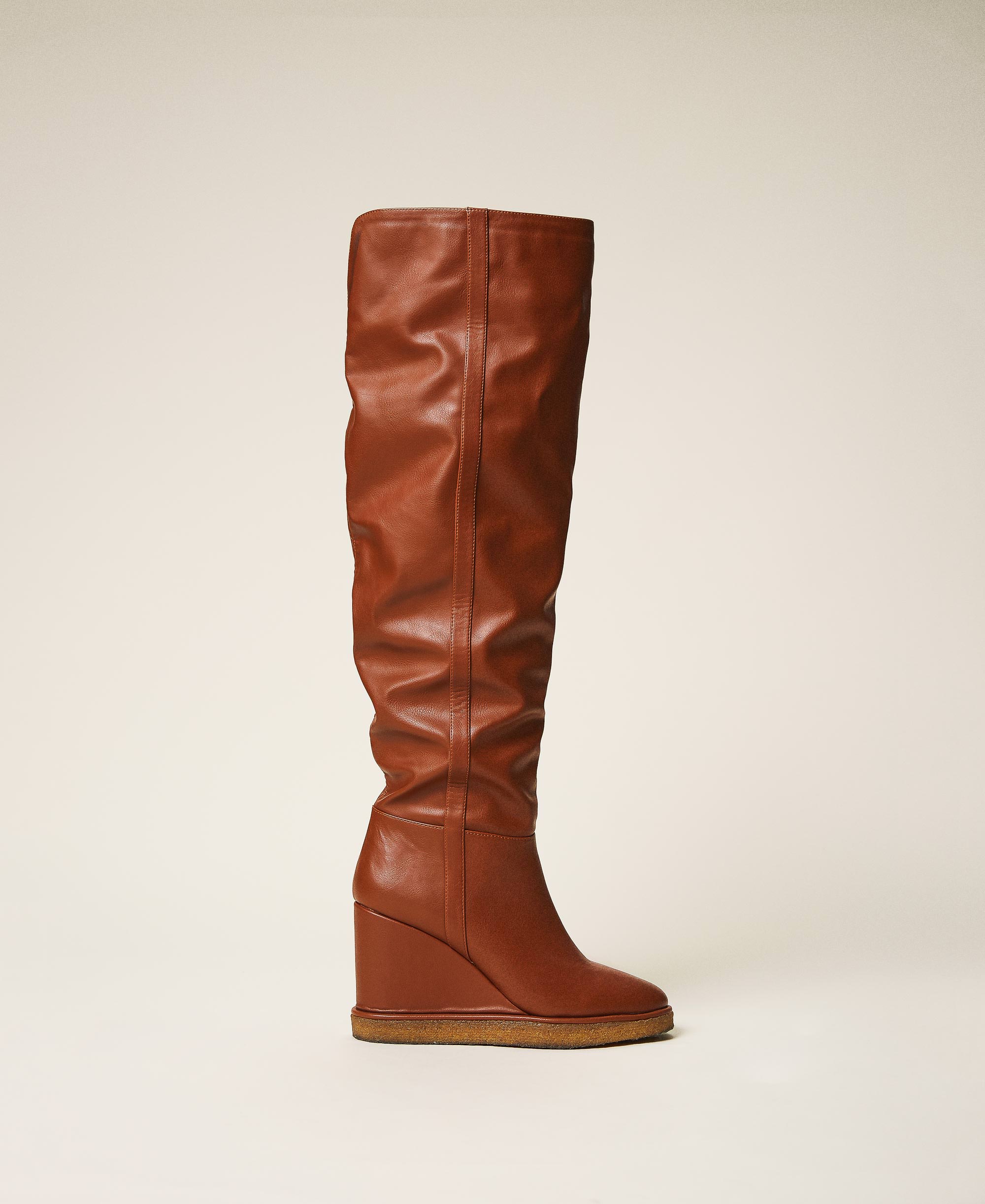 Thigh-high boots with wedge