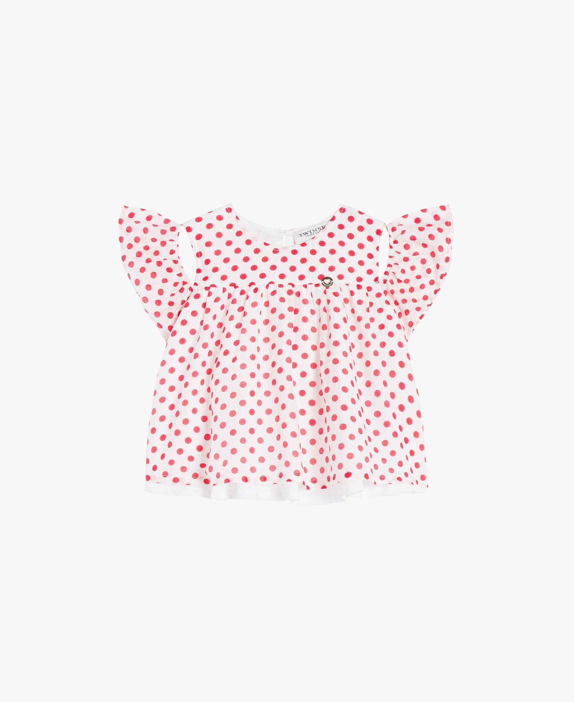 blusa blanca con lunares negros