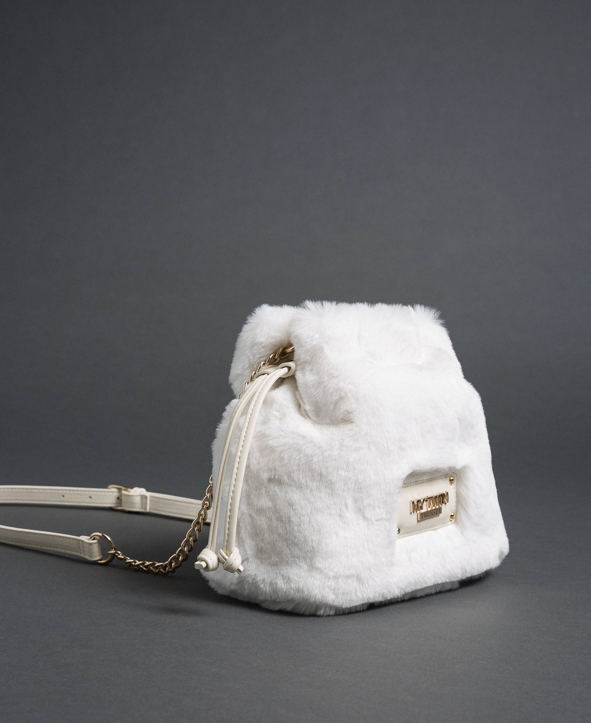 white faux fur bag