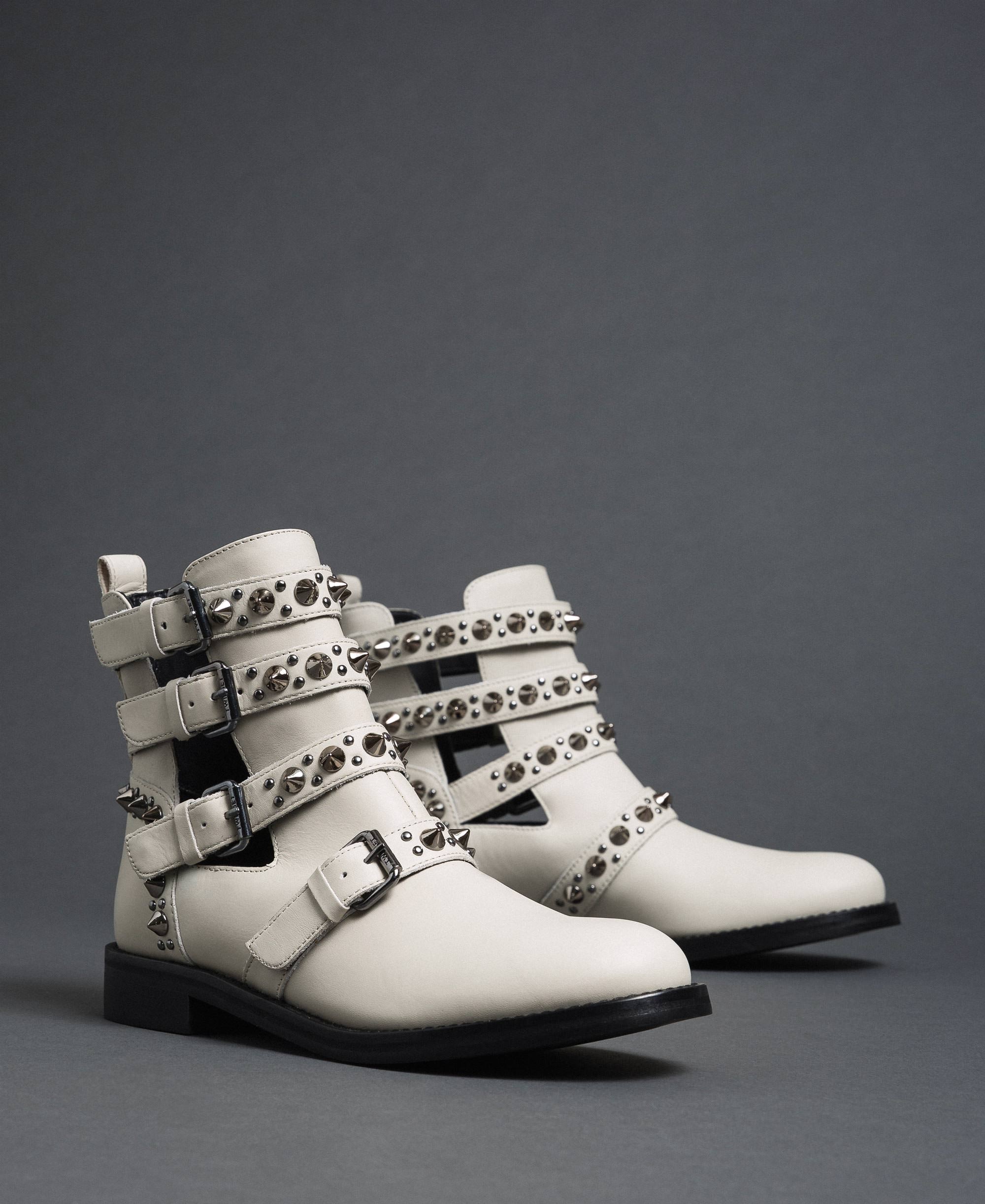 Leather biker boots with straps and studs