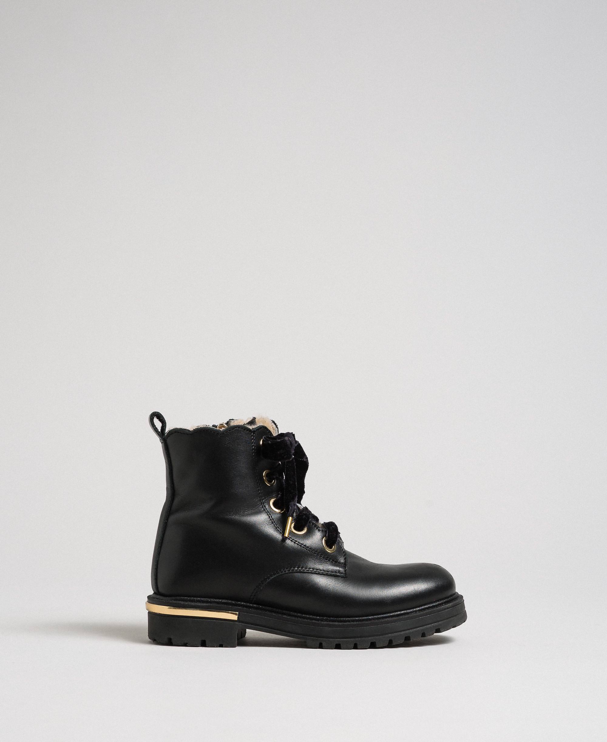 black ankle boots with metal detail